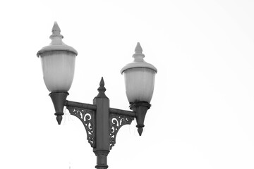 Fototapeta na wymiar Antique lamps at street - monochrome