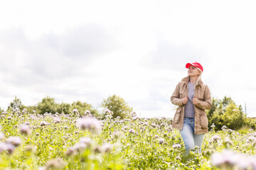 Portrait of beautiful girl in field