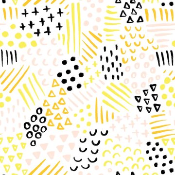 Seamless abstract background painted geometric scribble shapes. Repeating doodle pattern yellow, pink, orange, and black on pink.