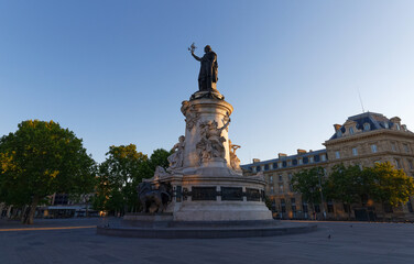 Fototapeta premium Monument to the republic, bronze statue of Marianne, a personification of the French republic at the Place de Republique in Paris, France