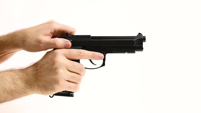 Man reloads gun and shot on white background