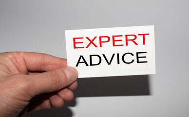 Message on the card Expert advice, in hands of businessman.