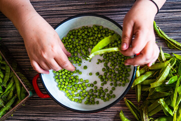 woman hands holding fresh green beans