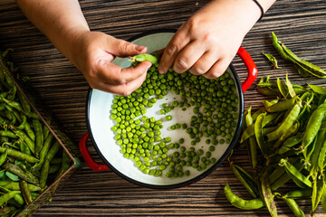 woman hands holding fresh green beans