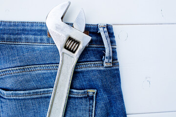 Background with tools in the pocket of blue jeans. Give dad a present. Happy fathers day concept.
