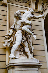 Statue of Hercules fighting Antaeus at Hofburg palace entrance, Vienna, Austria