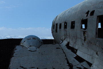 Abandoned old aircraft located on a volcanic black beach in Iceland