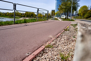 Red asphalt bicycle lane in the city