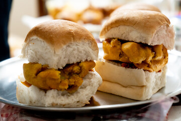 Selective focus macro shot of vada pav a fried potato in small buns a popular street food snack in...