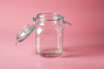Airtight jar with a glass lid on a uniform background