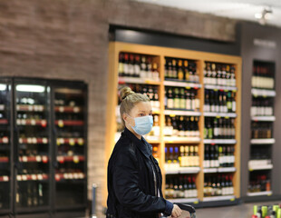 supermarket shopping, face mask and gloves,Woman choosing a dairy products at supermarket	