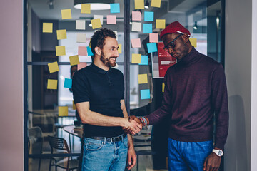 Serious african american man designer in eyewear puzzles on solution