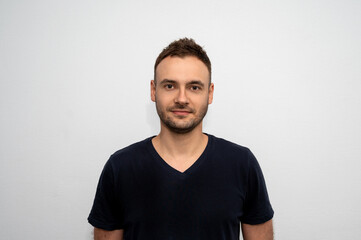 portrait of an attractive man with stubble in a black t-shirt