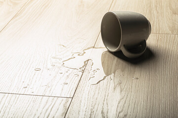 Laminate background.. Wooden laminate and parquet board with spilled water. Moisture protection of...