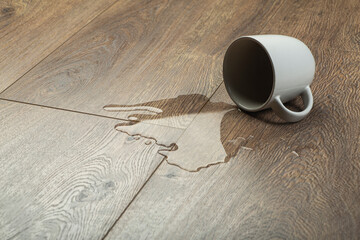 Laminate background.. Wooden laminate and parquet board with spilled water. Moisture protection of...