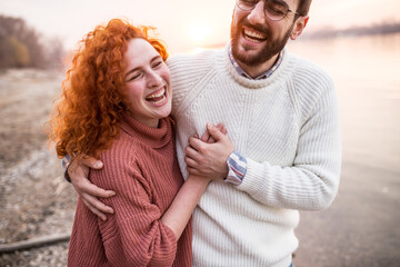 Portrait of beautiful young couple enjoying nature