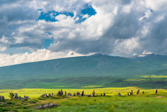 Landmark of Armenia - stones in a field with holes in Karahunj, Armenian Stonehenge - Zorats Karer