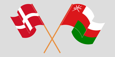 Crossed flags of Oman and Denmark