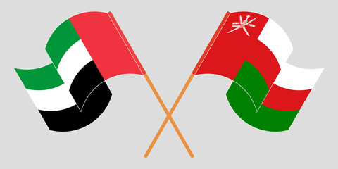 Crossed flags of Oman and the United Arab Emirates