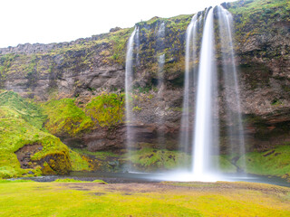 Seljaland Waterfall, Icelandic: Seljalandsfoss, front view on sunny day, Iceland