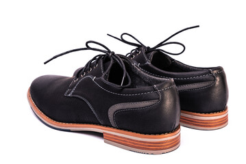 simple black men's shoes on a white background, unbranded and unlabeled
