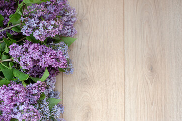 Lilac against the background of wooden boards in rustic style