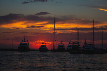 Obraz premium Boats during colorful sunset at the harbour in Zadar, Croatia