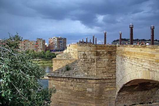 a view of the ancient Stone Bridge, or Puente de Piedra in Spanish, over the Ebro River in Zaragoza, Spain