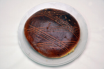 whole and sliced cakes . traditional sweet gata white backgrounds . round oven . Traditional country sweet homemade Azerbaijan cake gata.