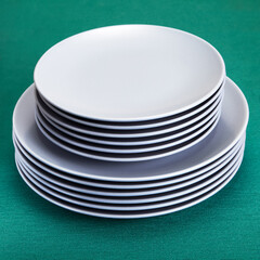 Ceramic plates coated with gray glaze, on green.