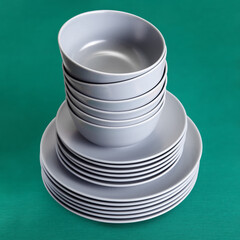 A stack of ceramic kitchen utensils in gray glaze.