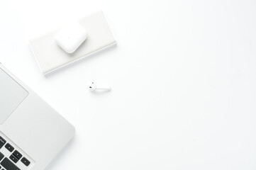 Mockup. Flatlay camera notebook and pods on white