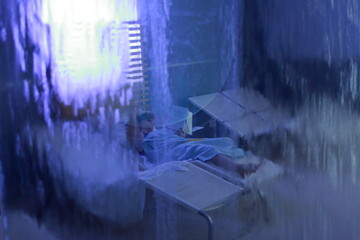 Amusing image of a woman sitted in a SPA seen through a wall of water