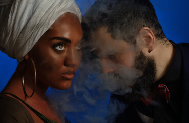 african girl and bearded caucasian man in dark backgrounds, interracial couple of musicians