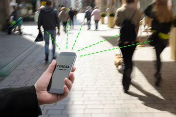 Smart phone with Corona Warn App, the contact tracking or tracing application against Covid 19...