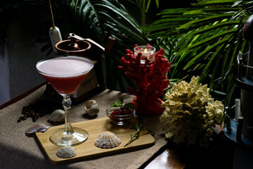 beautiful exotic cocktail with fruits on a beach background