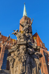 View of Collegiate Church of the Holy Cross and St. Bartholomew in Wrocław. Gothic church located in the Tumski Island ("Cathedral Island"). Wroclaw, Poland.