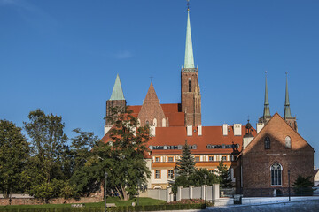 View of Collegiate Church of the Holy Cross and St. Bartholomew in Wrocław. Gothic church located in the Tumski Island ("Cathedral Island"). Wroclaw, Poland.