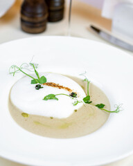 healthy soup in white plate on isolate