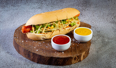 Brazilian hot dog with bread, straw potatoes, ketchup, mayo and lettuce