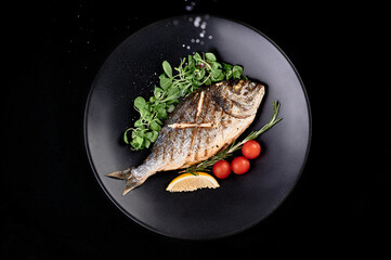 tasty grill fish in big metal plate