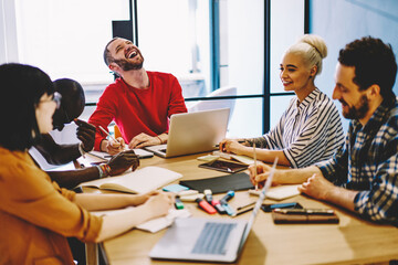 Skilled group of employees team working on business strategy share ideas and talking .