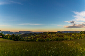 View of nature surrounded by forest and in the sky full of clouds with a view of the mountain landscape around the Beskydy Mountains.