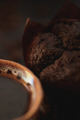 brown chocolate muffin wit cup of coffee