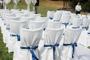 Beautifully decorated and arranged chairs for a festive Banquet. Decor, wedding