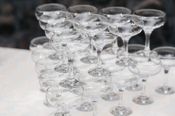 Festive glasses on the festive table during the Banquet. Alcoholic beverage