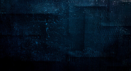 Blue dark wall, stucco, dark concrete. Dark decorative stone. Floodlight. Empty night wall, neon...