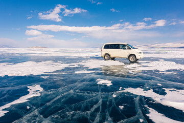 The russian vans on frozen lake baikal, siberia, Russia. The deepest lake in the world with...