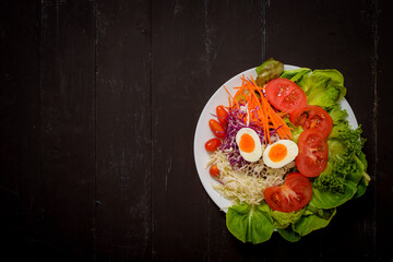 Vegetables Salad on black  wooden  background