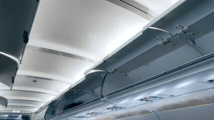 Moder airplane ceiling and open luggage compartment
